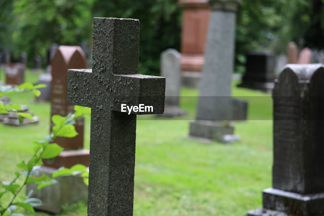 Stone cross in cemetery