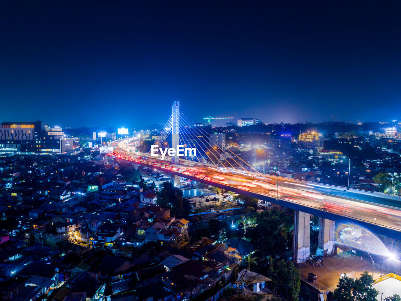 Aerial view of illuminated city at night