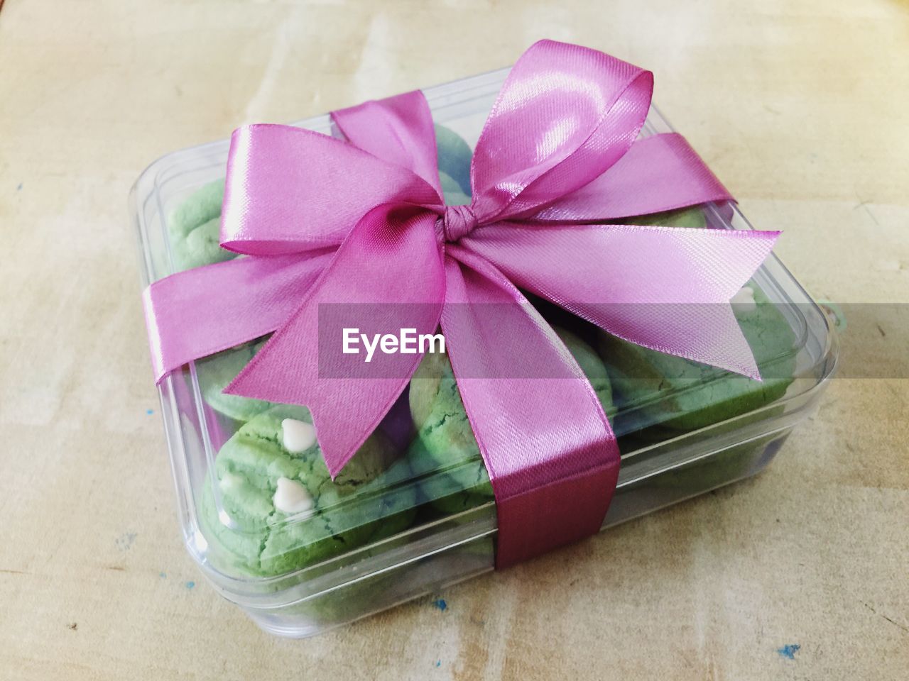 High angle view of cookies in box on wooden table