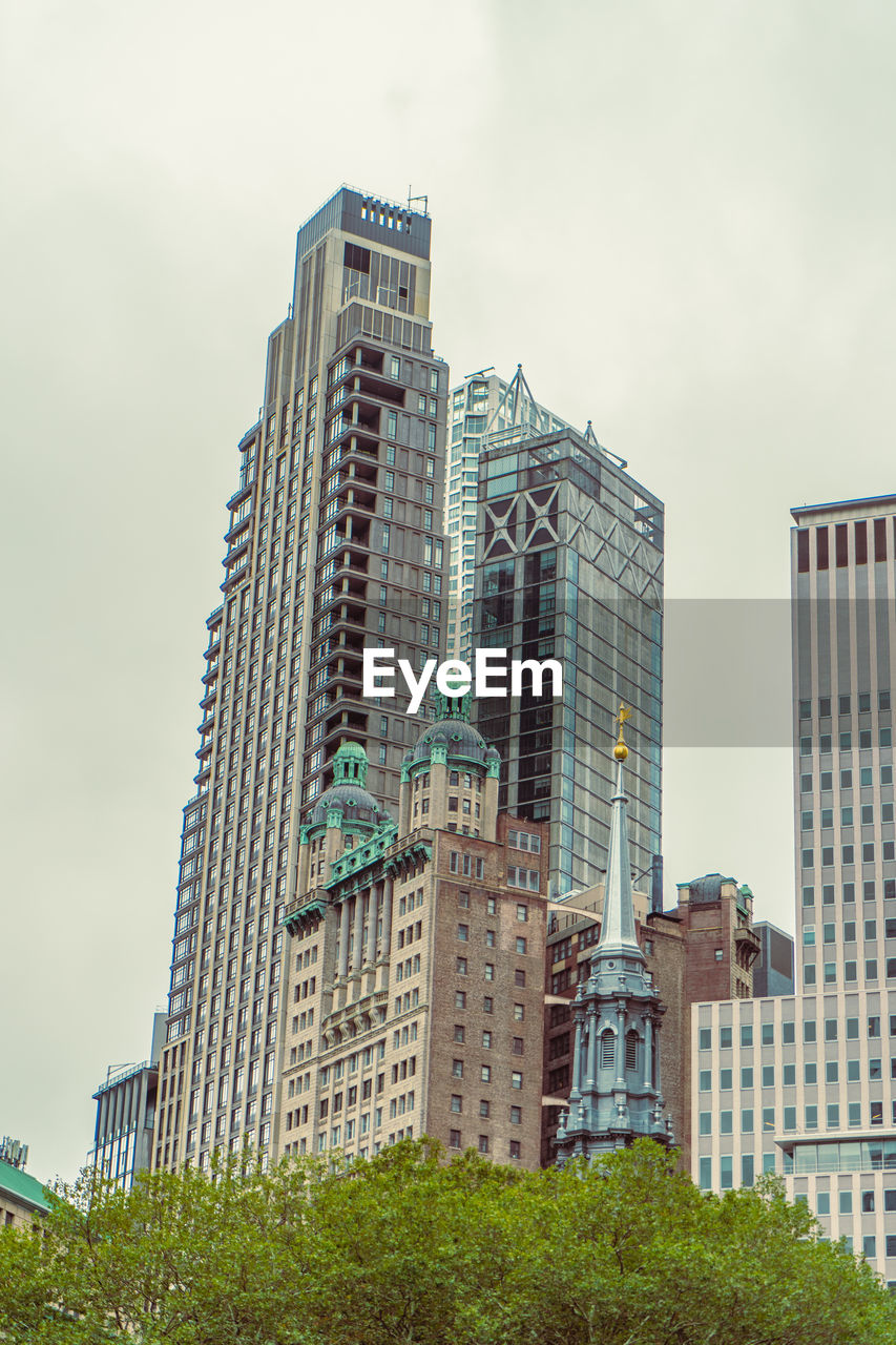 Low angle view of skyscrapers against sky