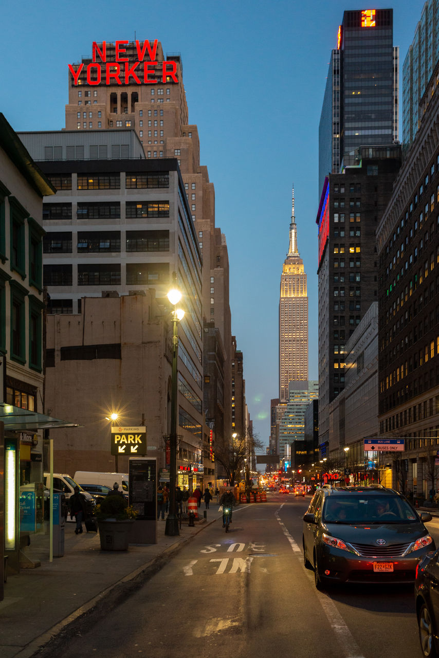 CITY STREET AND BUILDINGS AGAINST SKY