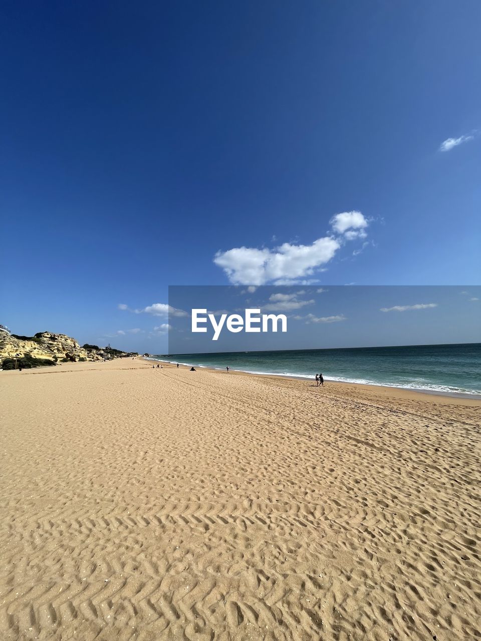 sky, nature, blue, water, sea, land, sunlight, beach, cloud, day, no people, beauty in nature, outdoors, scenics - nature, sand, architecture, reflection, travel, low angle view