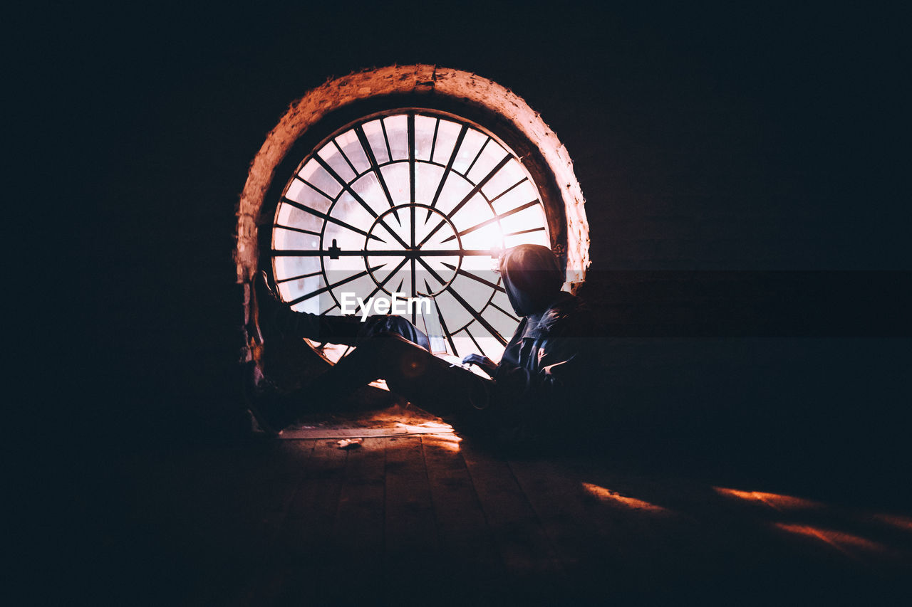 Man sitting by window