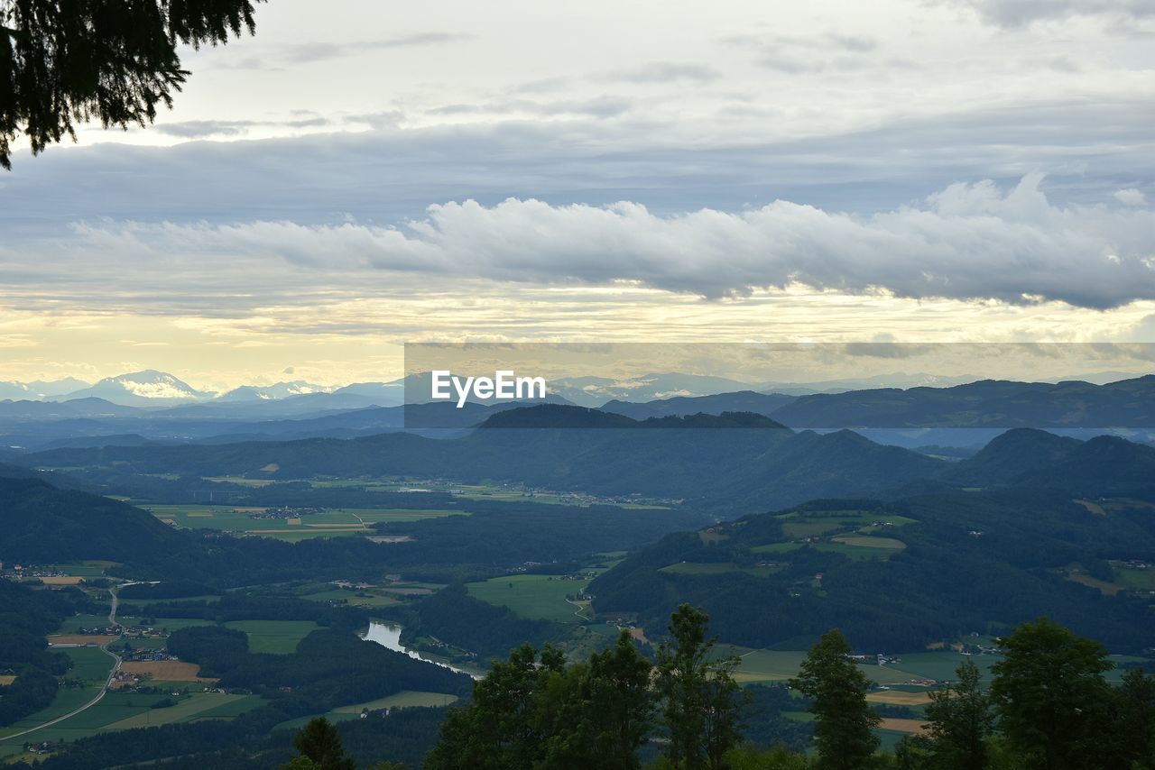 Scenic view of landscape and mountains against sky