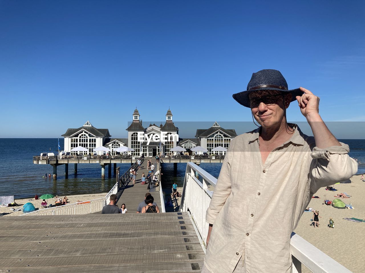 A man in a hat on the pier in sellin