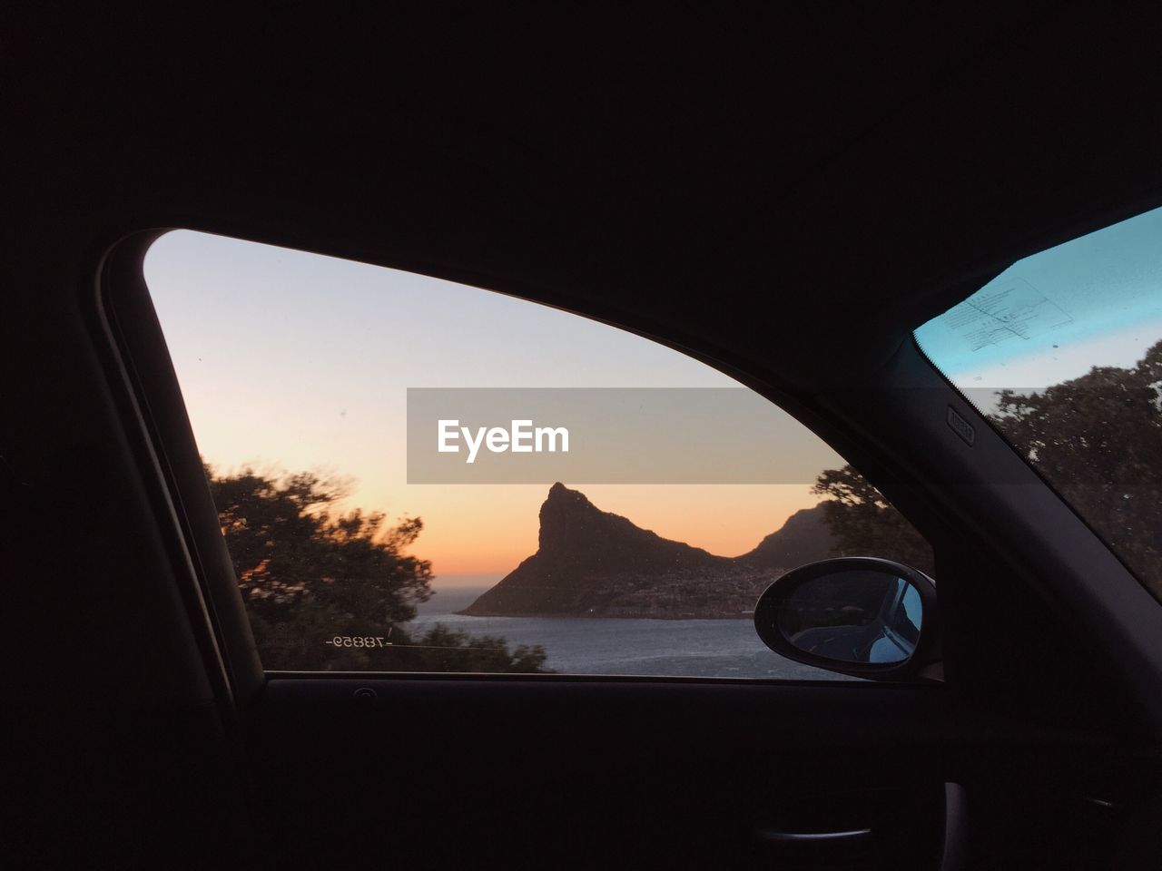 Scenic view of sea seen through car window