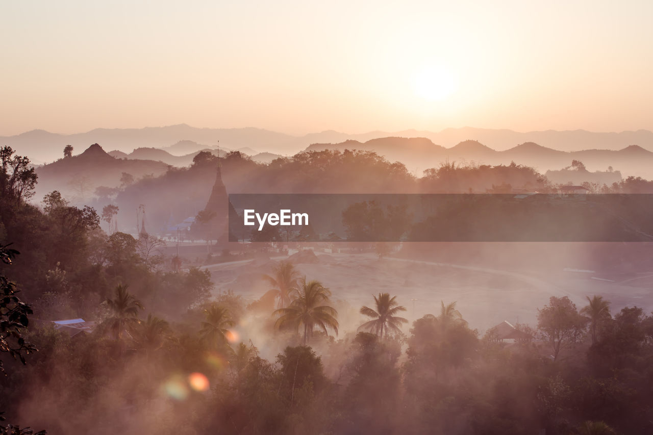 Scenic view of mountains against sky during sunset