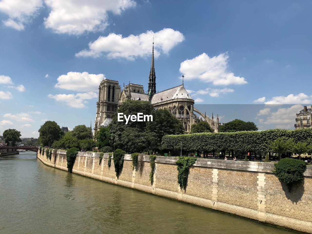 VIEW OF TEMPLE BY BUILDING AGAINST SKY