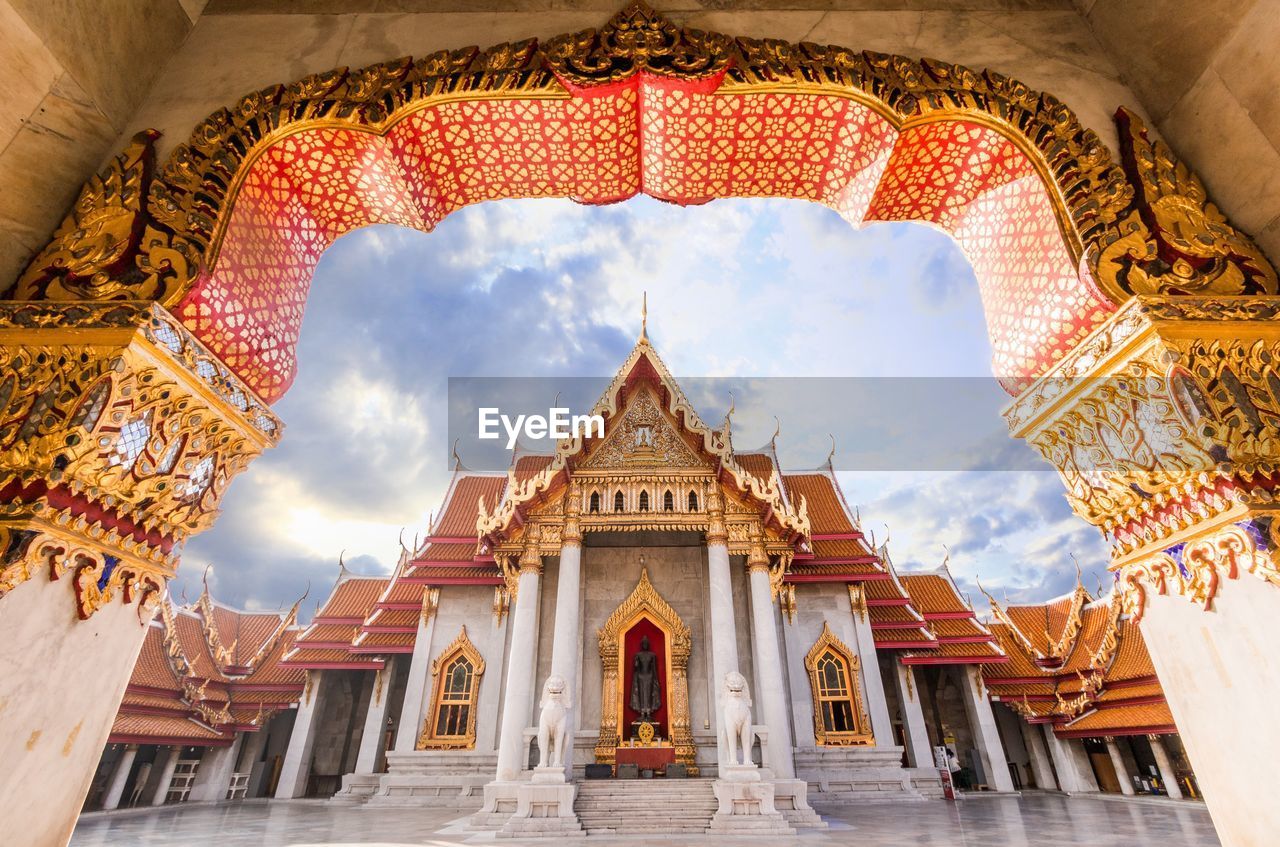 Low angle view of wat benchamabophit seen from entrance archway