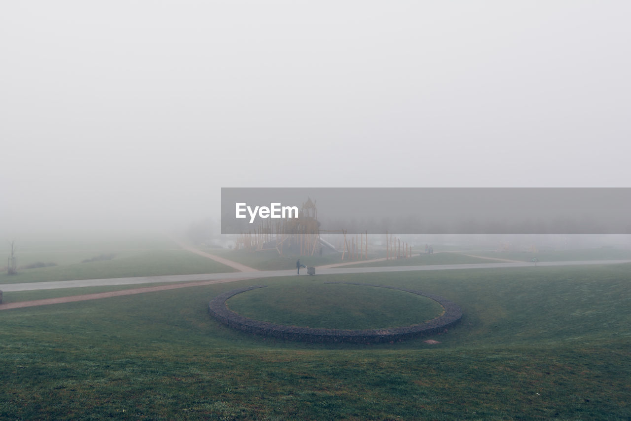 Scenic view of park in foggy weather