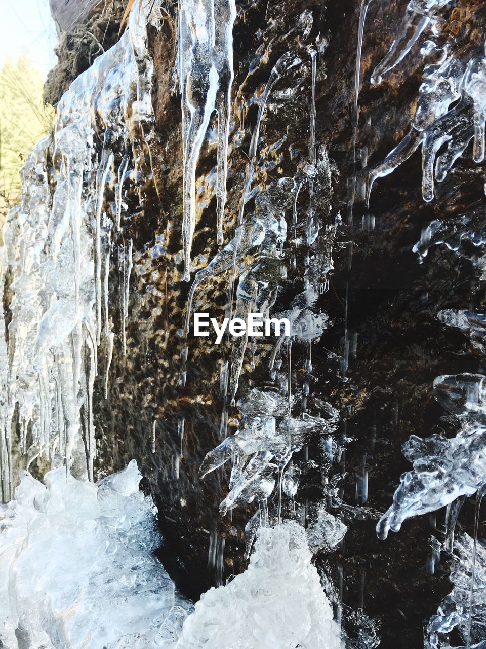 CLOSE-UP OF FROZEN ROCK FORMATION IN WINTER