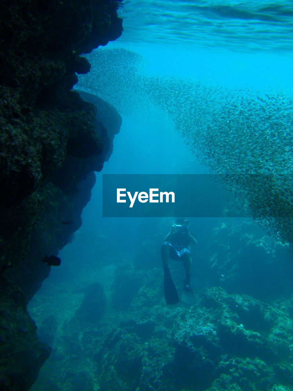 high angle view of man swimming in sea