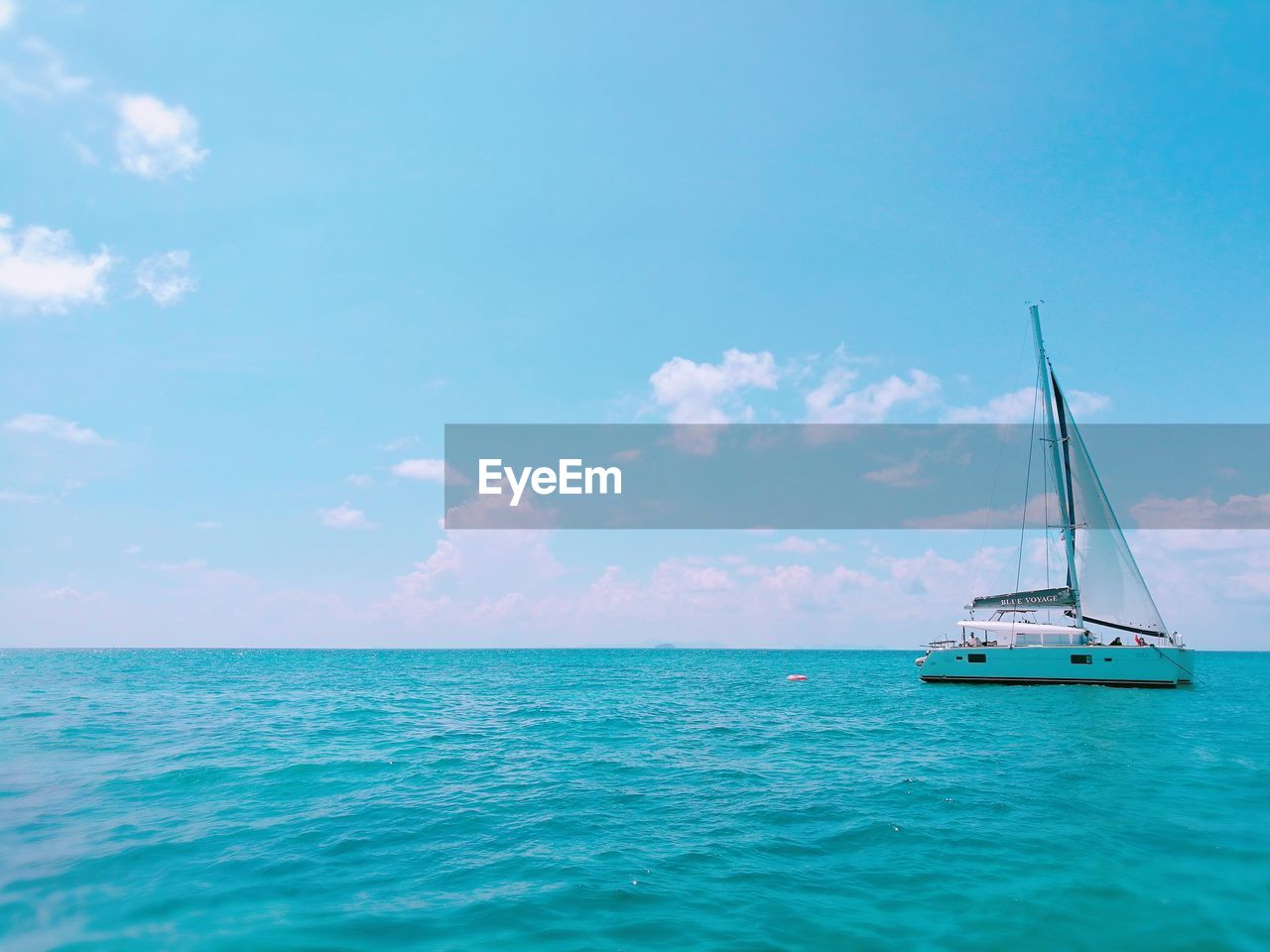 SAILBOATS SAILING IN SEA AGAINST SKY