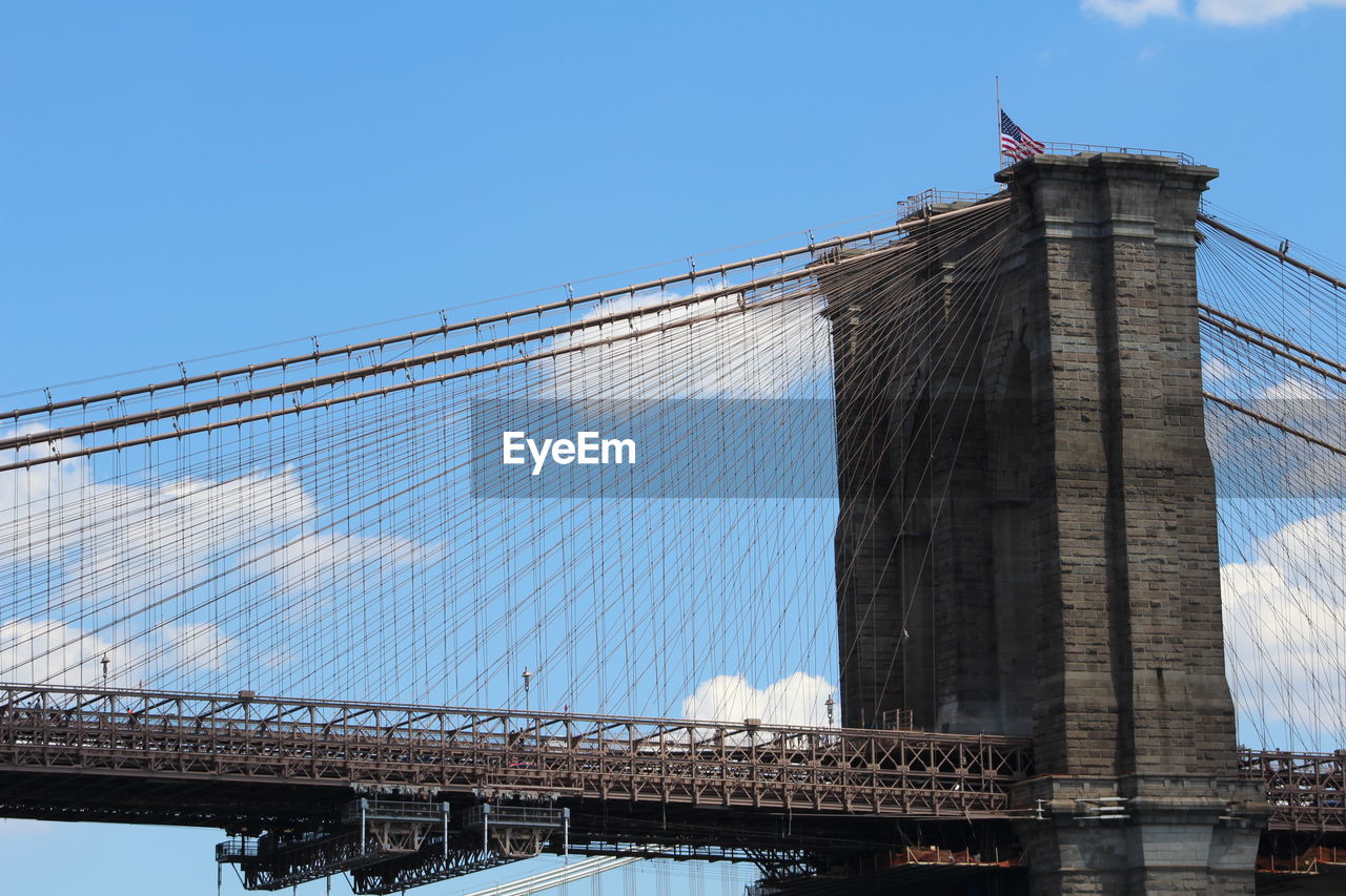 Low angle view of brooklyn bridge against sky