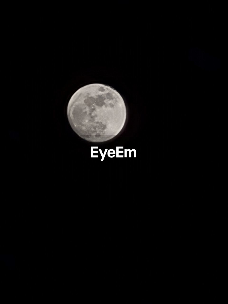 LOW ANGLE VIEW OF MOON IN SKY AT NIGHT