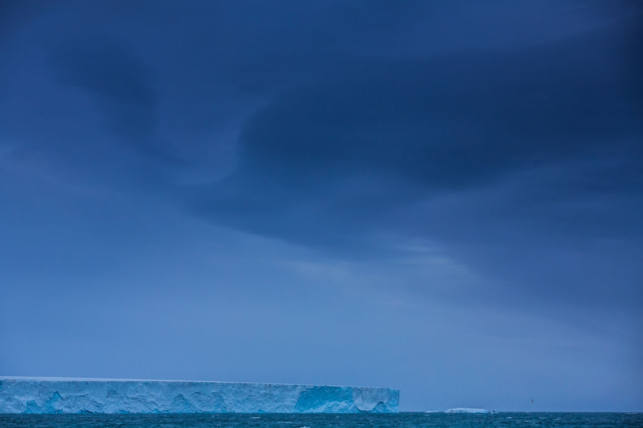 Scenic view of sea against blue sky