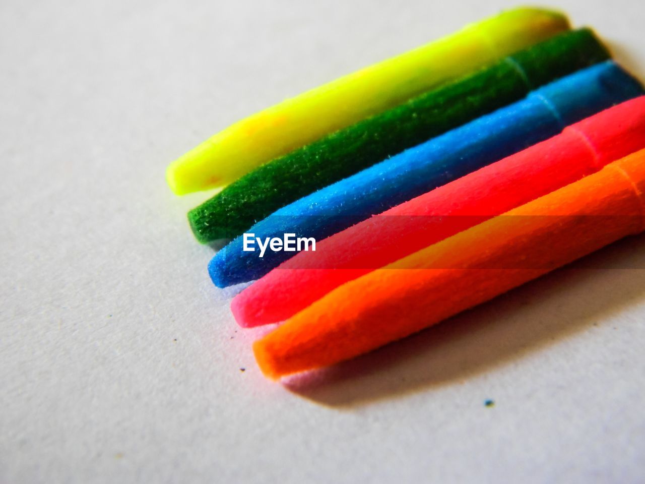 Close-up of colorful crayons on table