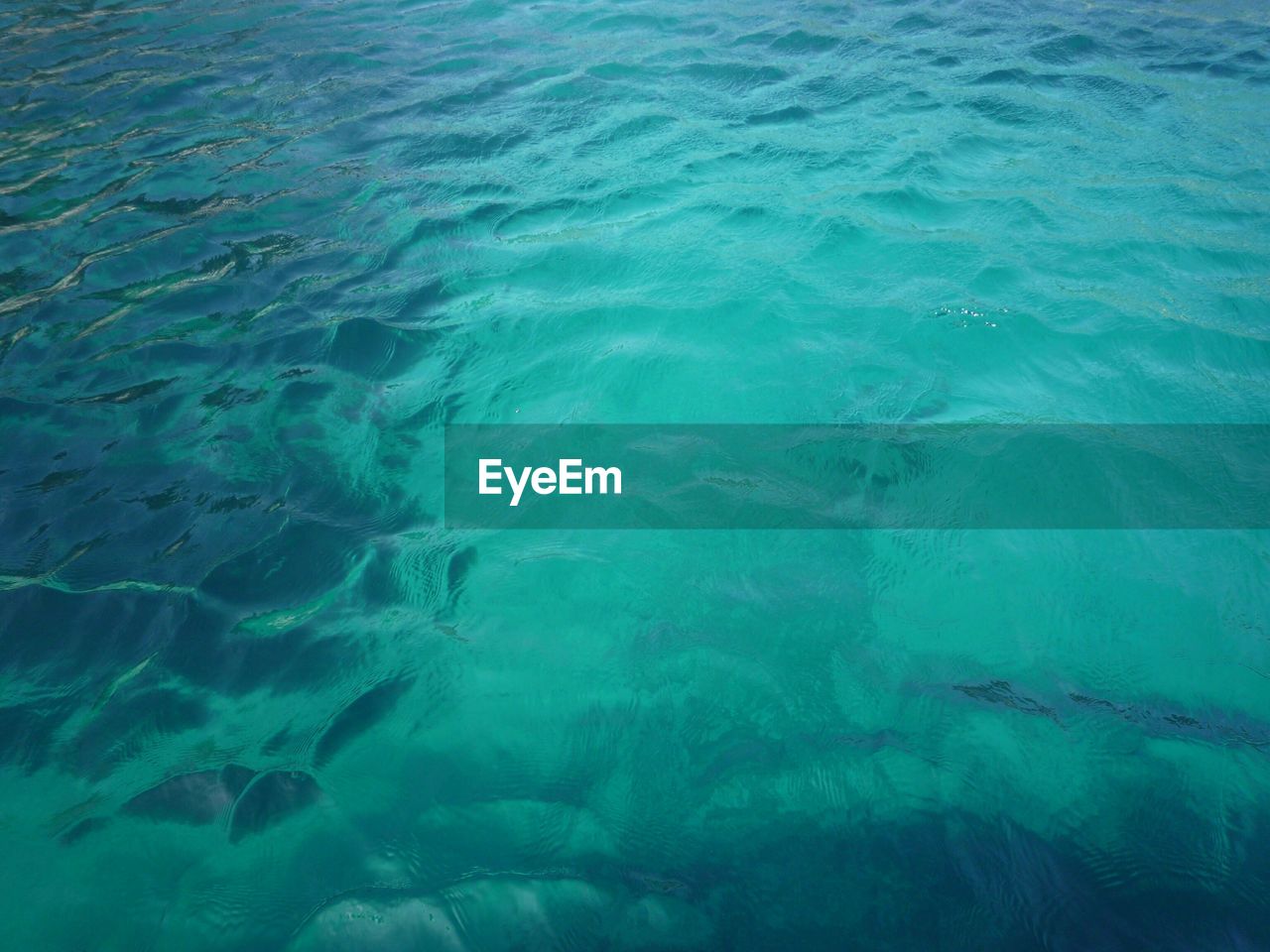 High angle view of turquoise water surface