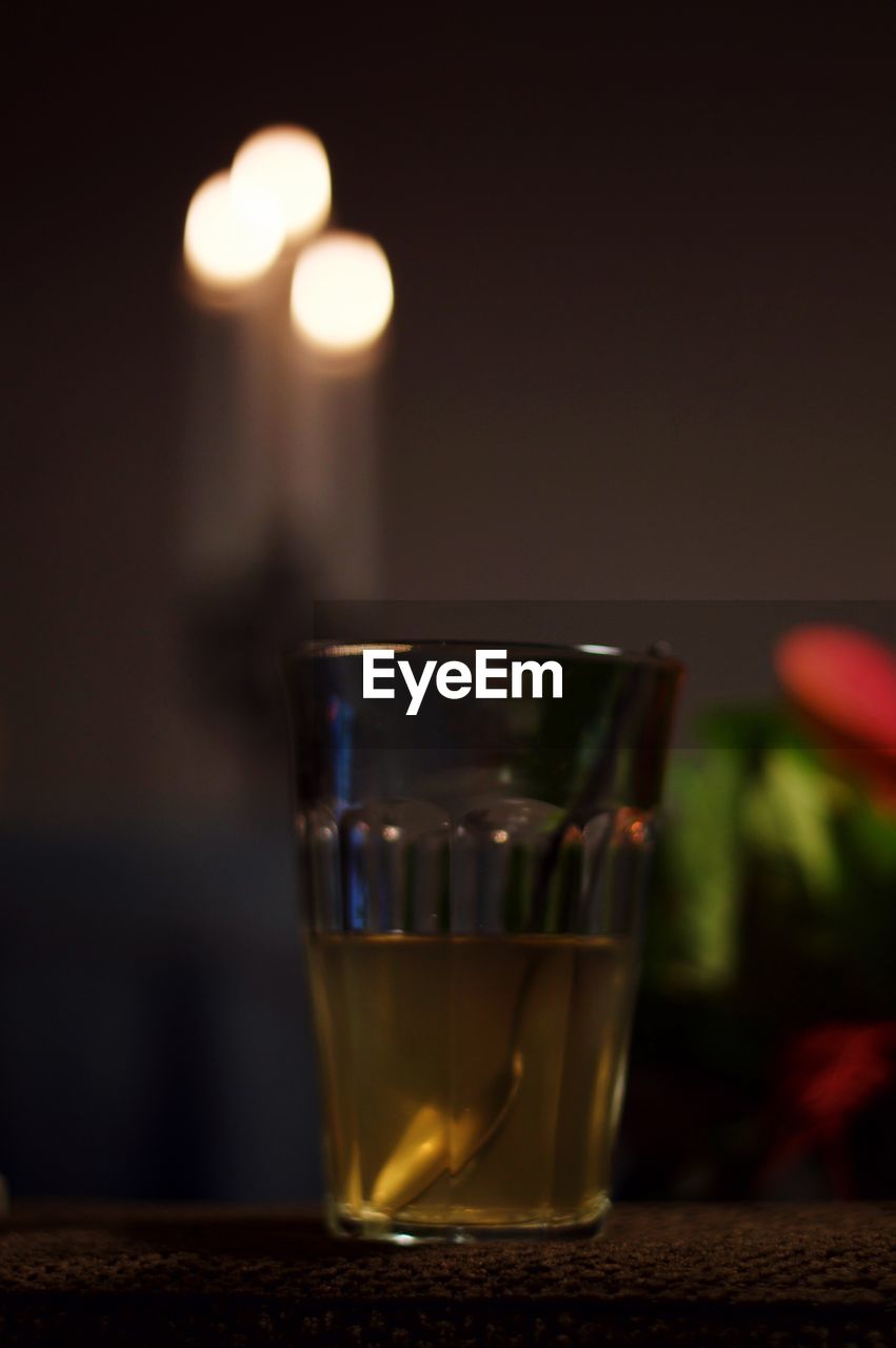 CLOSE-UP OF WINEGLASS ON TABLE