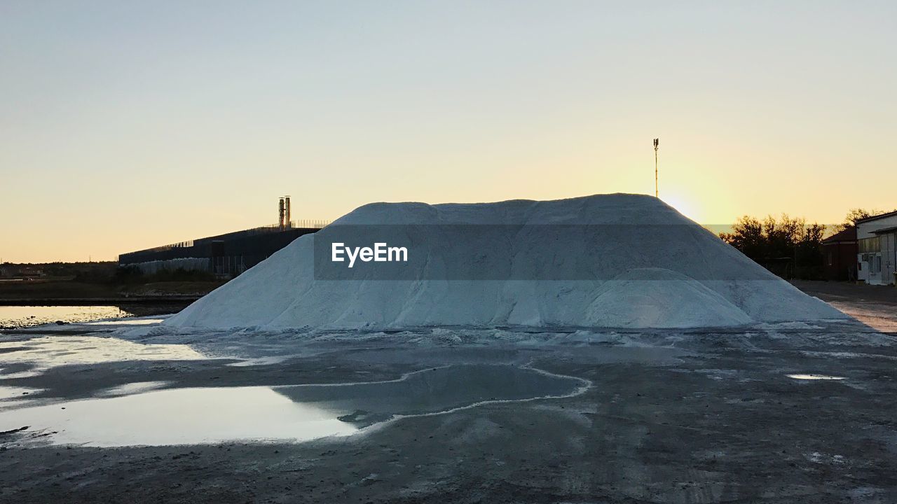 Scenic view of frozen lake against clear sky during winter