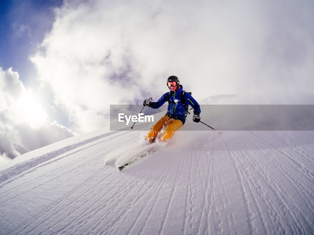 Low angle view of man skiing on mountain