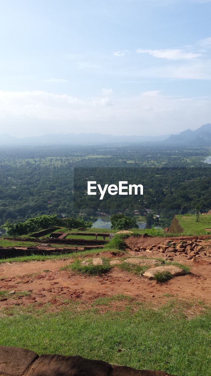 SCENIC VIEW OF FIELD AND MOUNTAINS AGAINST SKY