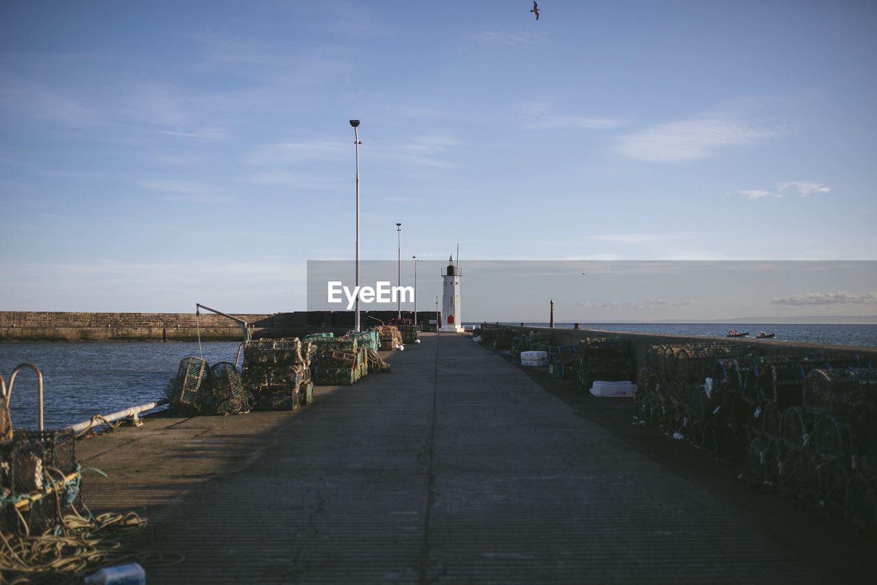 Pier over sea against sky