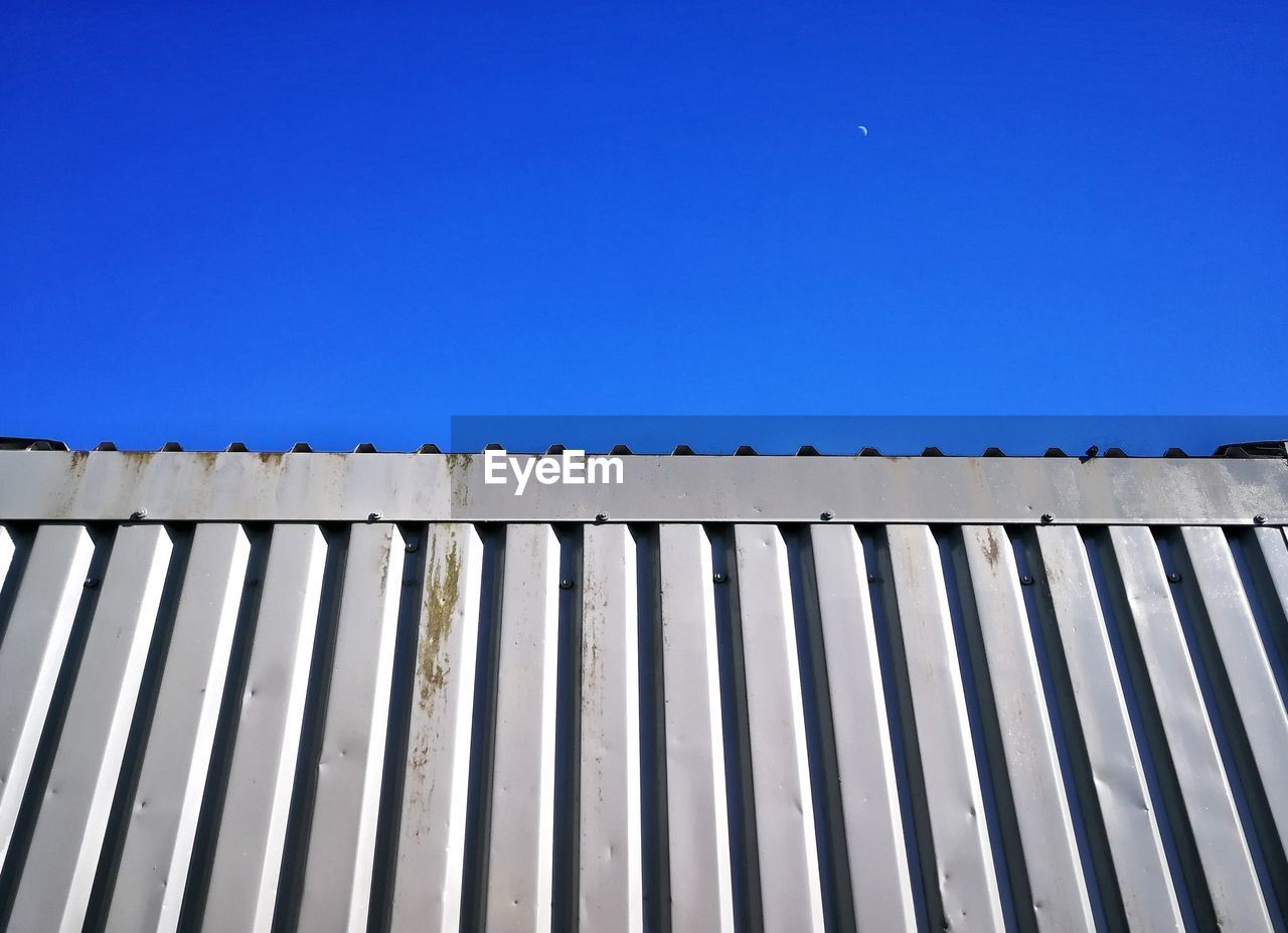 LOW ANGLE VIEW OF ROOF AGAINST CLEAR SKY