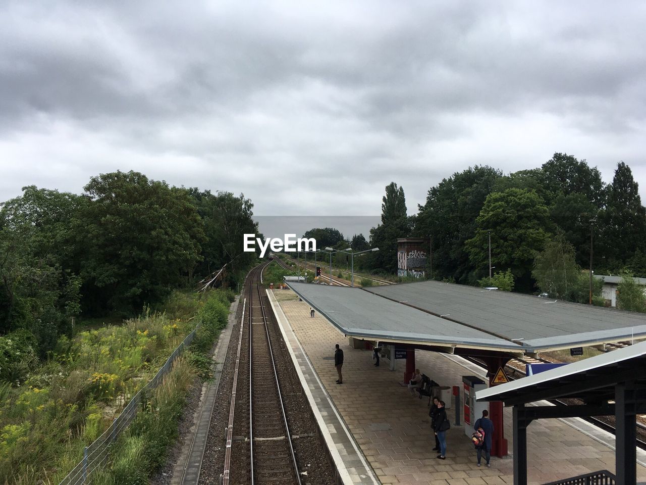 RAILROAD TRACKS ON RAILROAD STATION PLATFORM