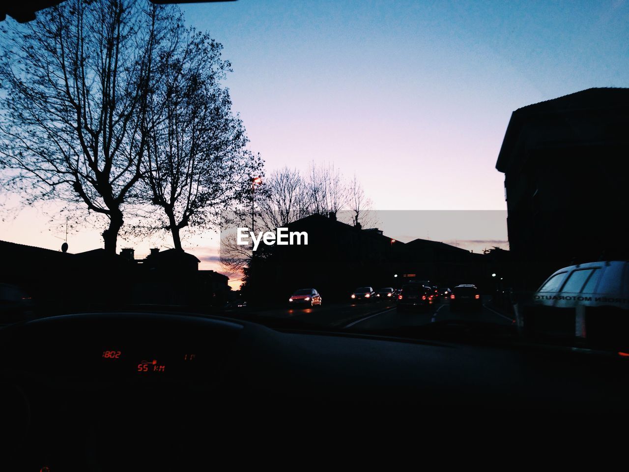 CARS ON ROAD DURING SUNSET