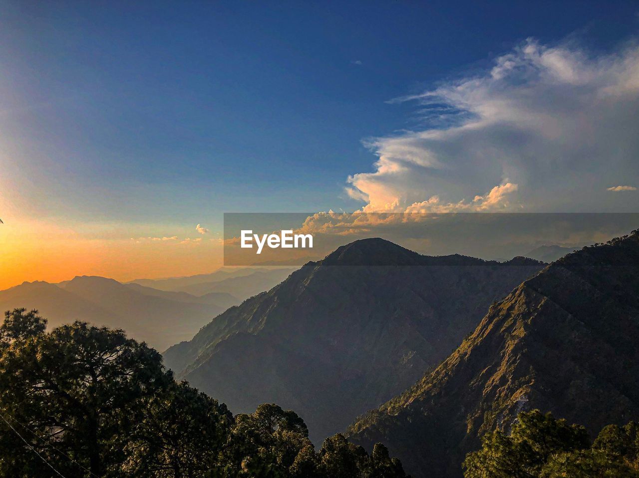 Scenic view of mountains against sky during sunset