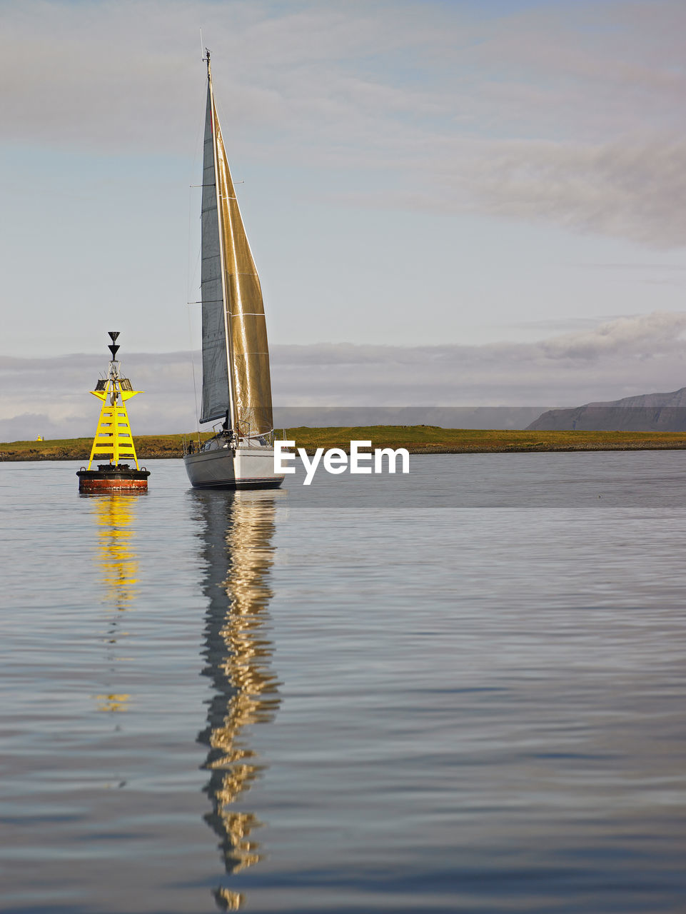 Sailboat in calm weather close to reykjavik