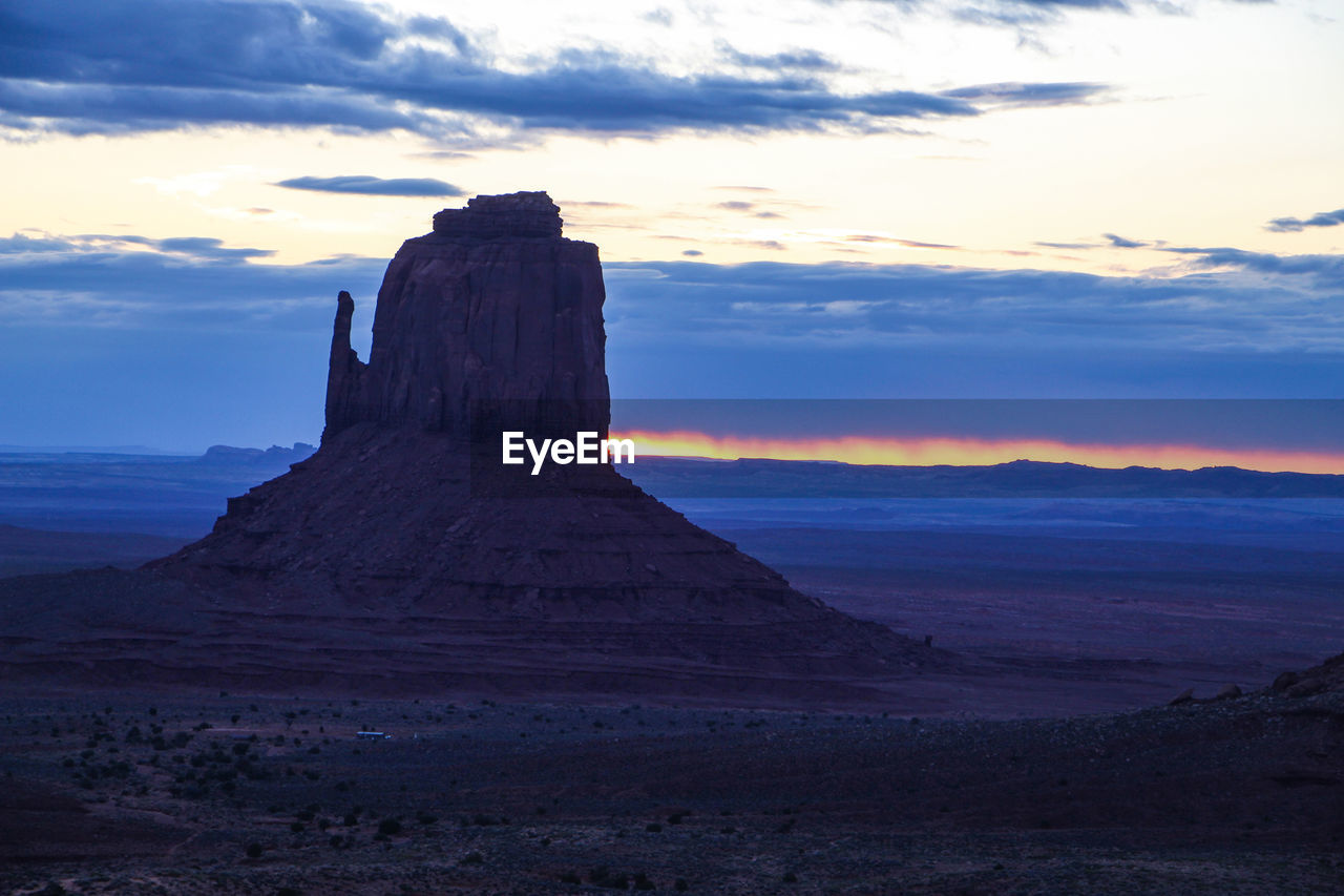 Rock formations at sunset in mountain valley 