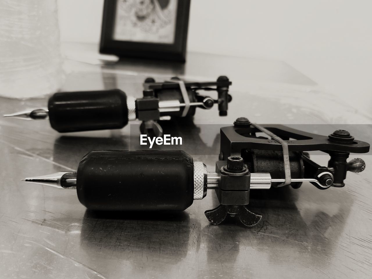 CLOSE-UP OF CAMERA ON TABLE WITH EYEGLASSES