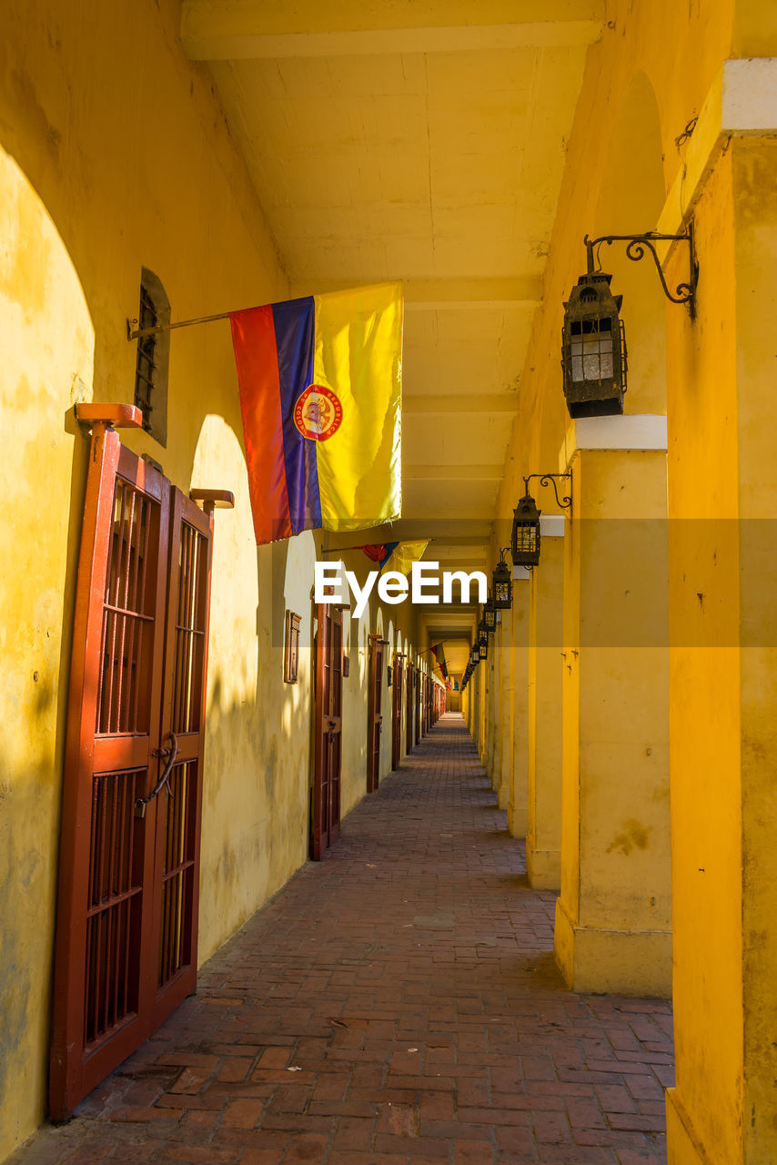 Colombian flags in corridor of historic building