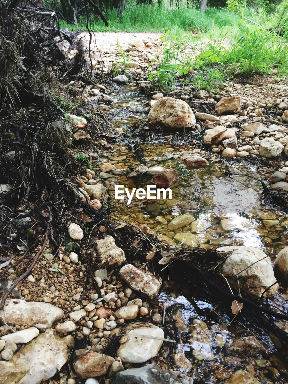 STREAM FLOWING THROUGH ROCKS