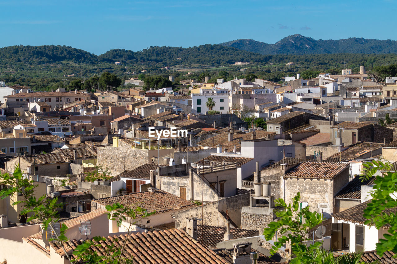 High angle view of townscape and mountains