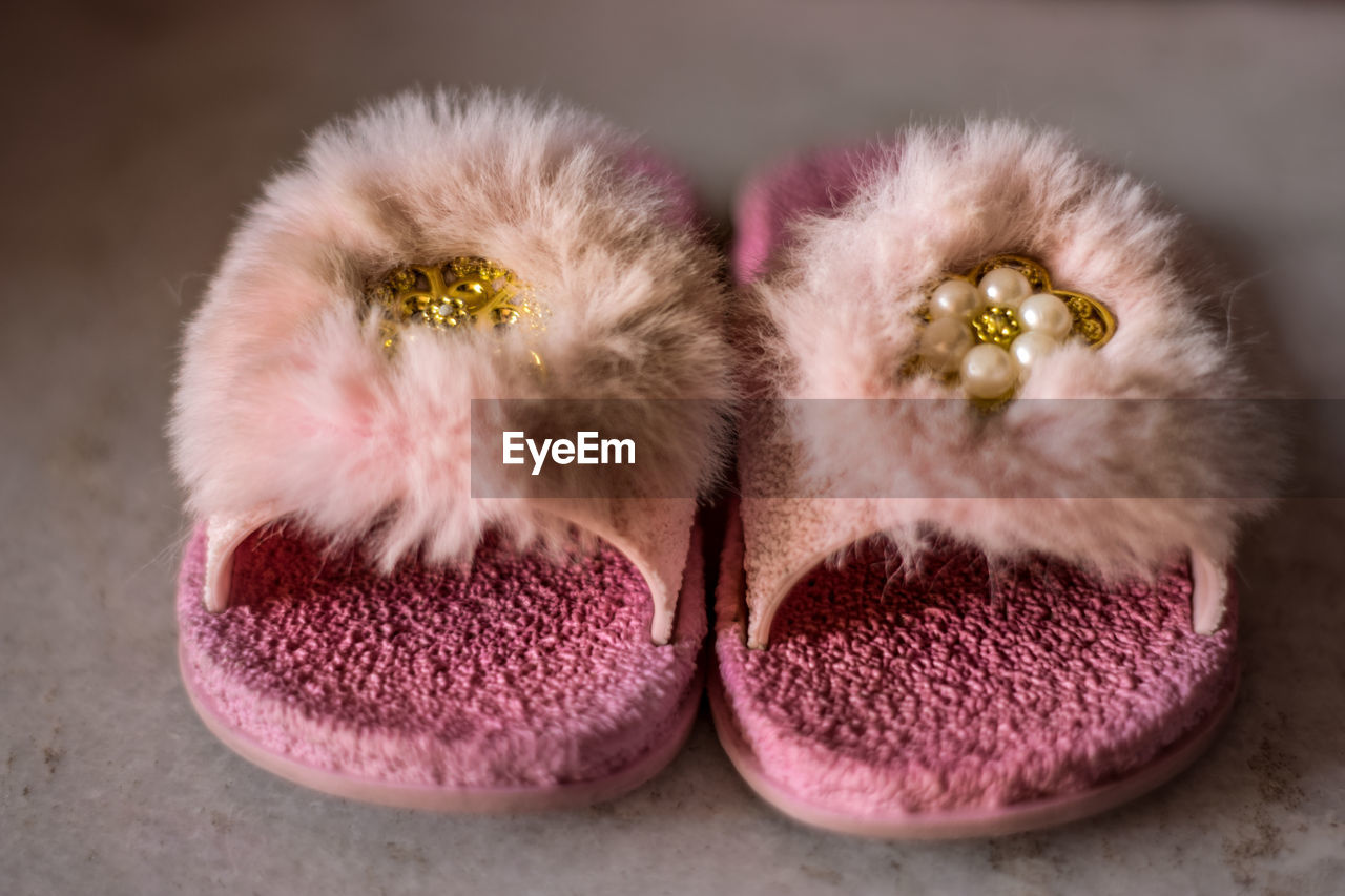 High angle view of pink slipper on table