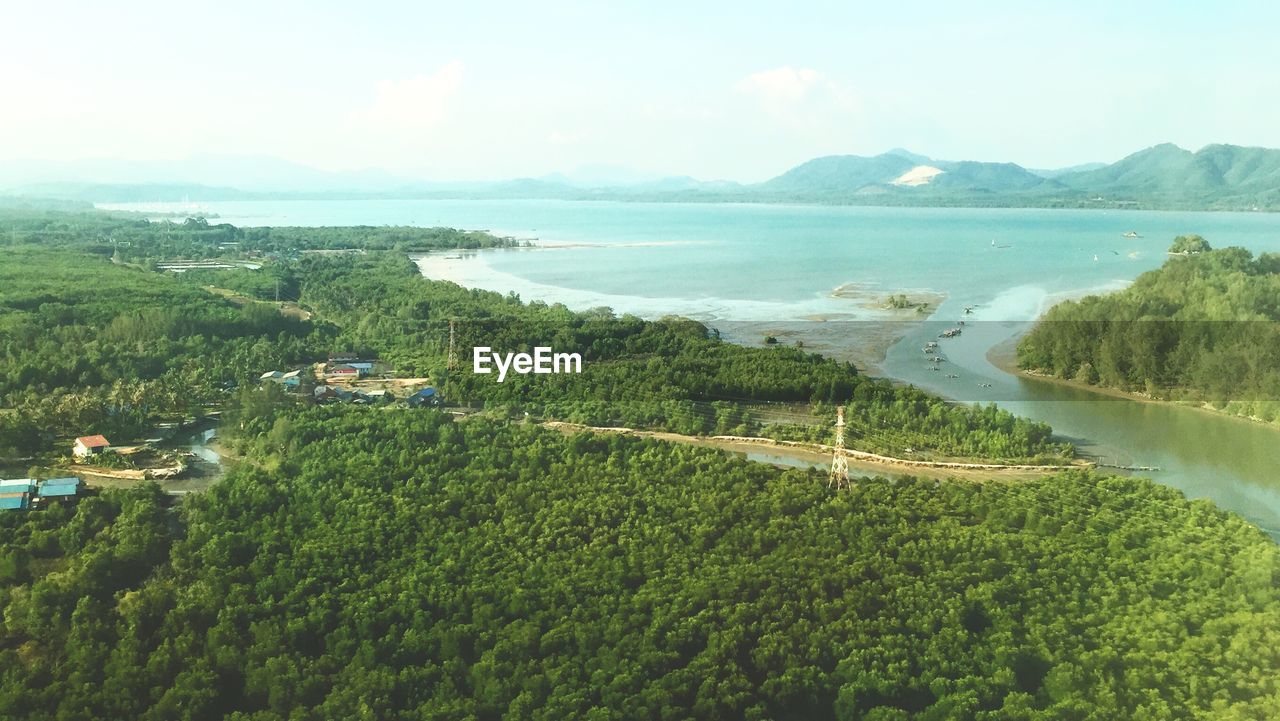 HIGH ANGLE VIEW OF SEA AND MOUNTAIN AGAINST SKY