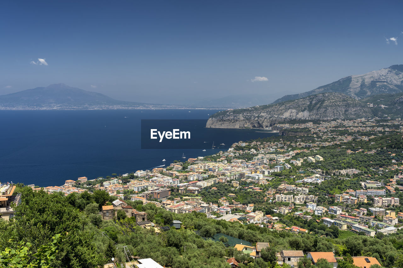 High angle view of townscape by sea