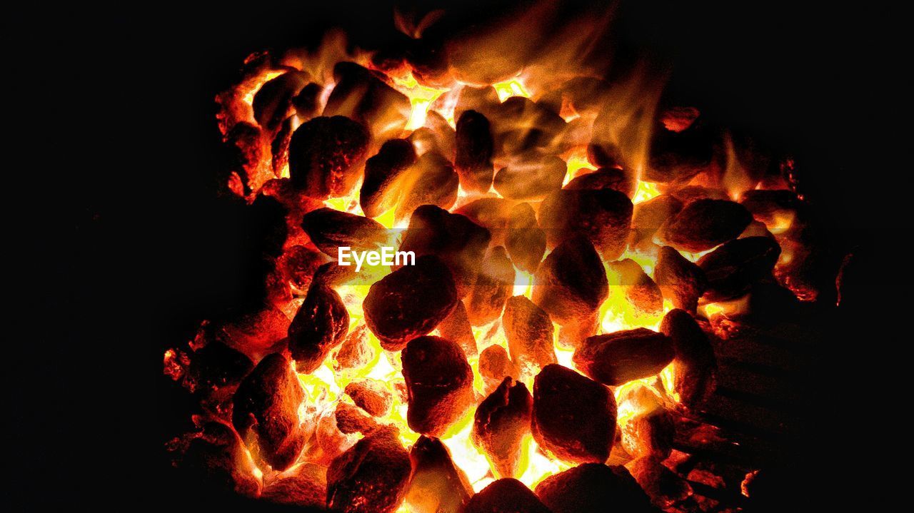 Close-up of fire burning at night