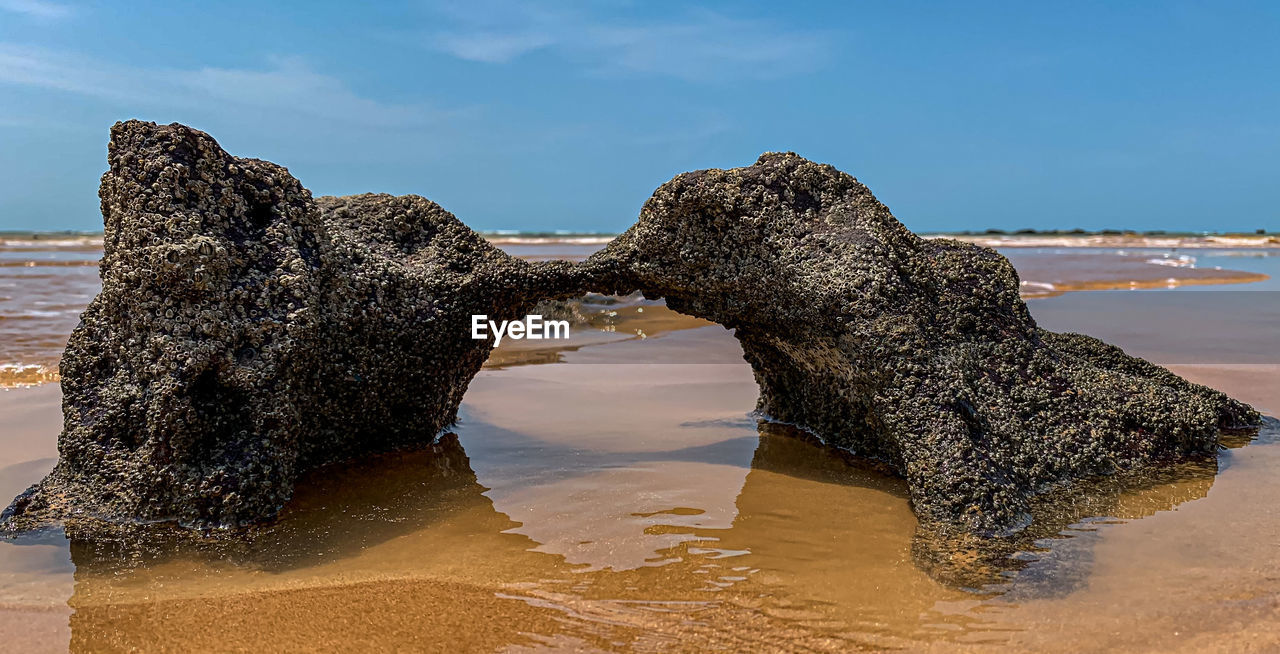 ROCK FORMATIONS ON BEACH