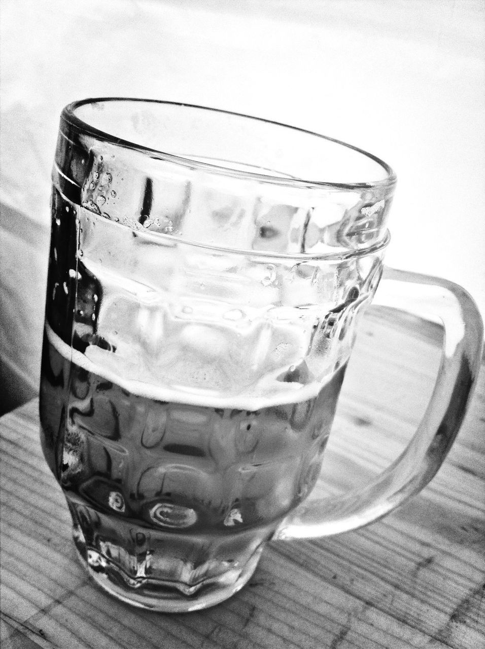 Close-up of beer mug on table