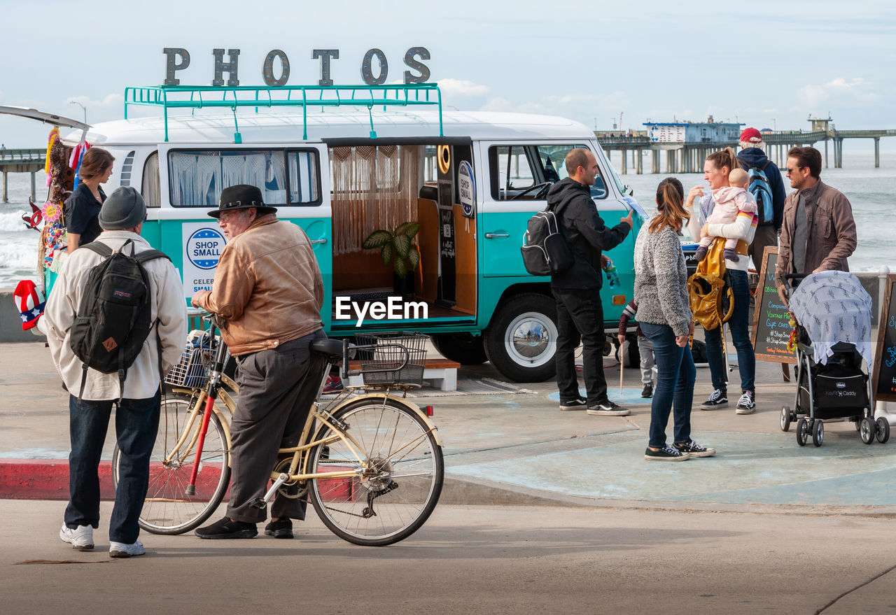 PEOPLE CYCLING ON ROAD