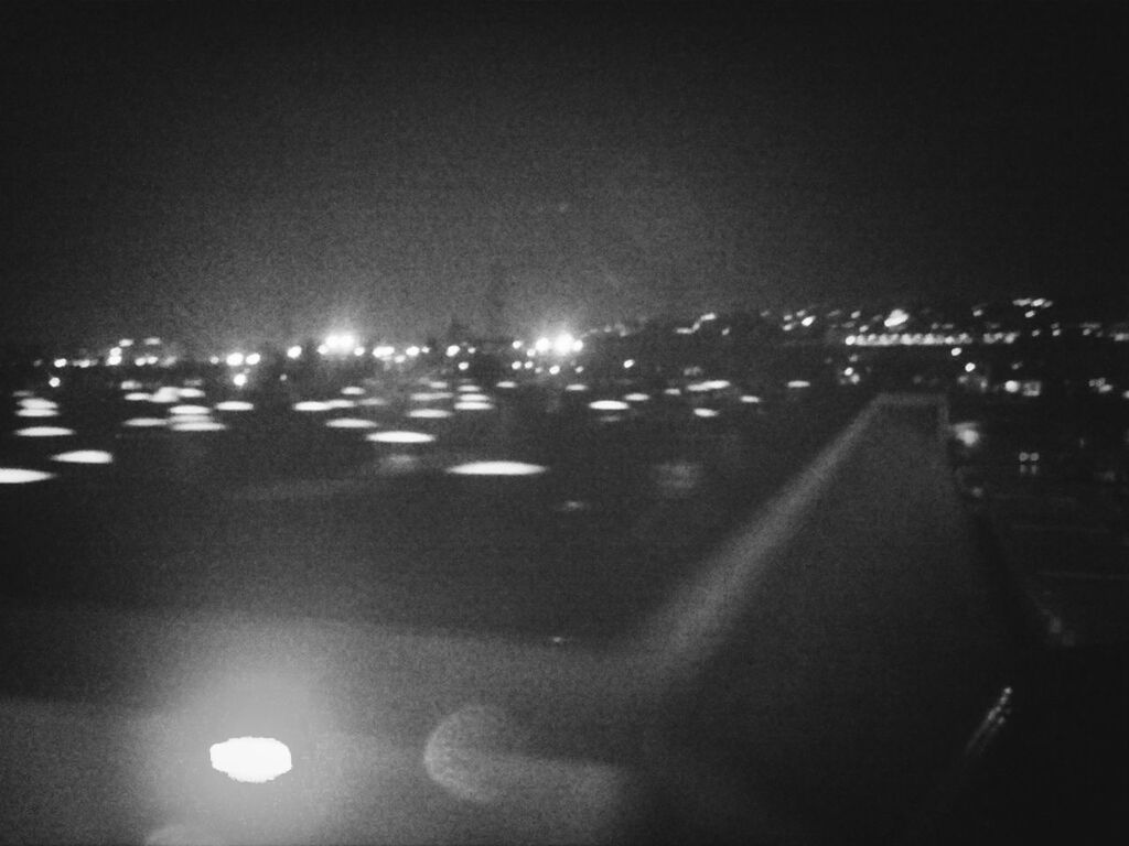 DEFOCUSED LIGHTS IN CITY AT NIGHT
