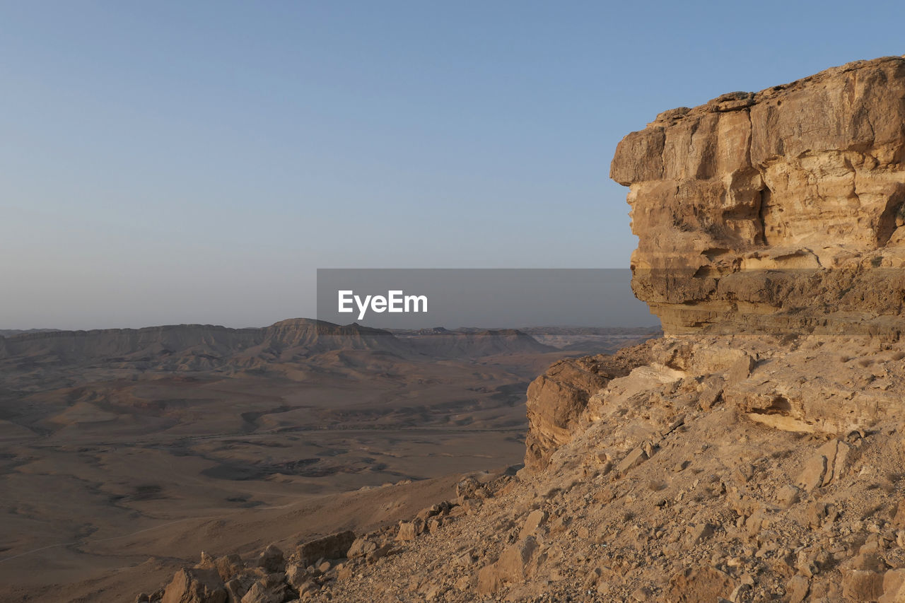 Scenic view of desert against clear sky