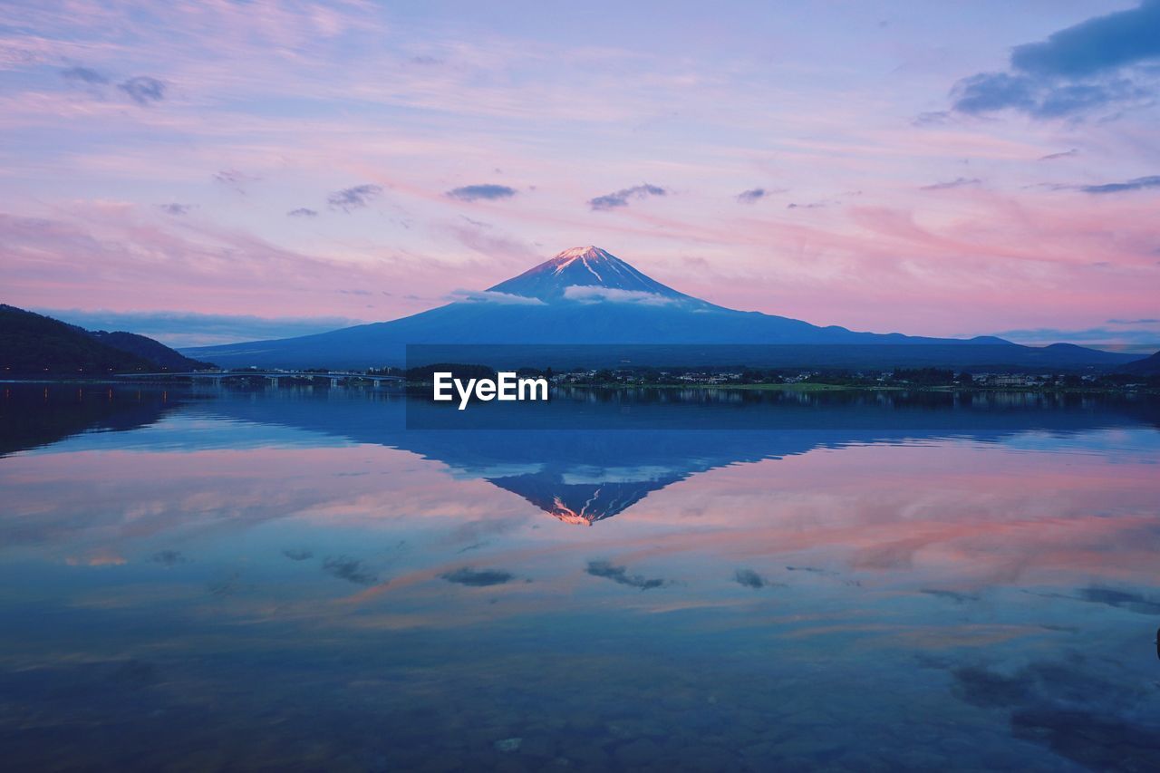 Scenic view of lake against sky during sunset