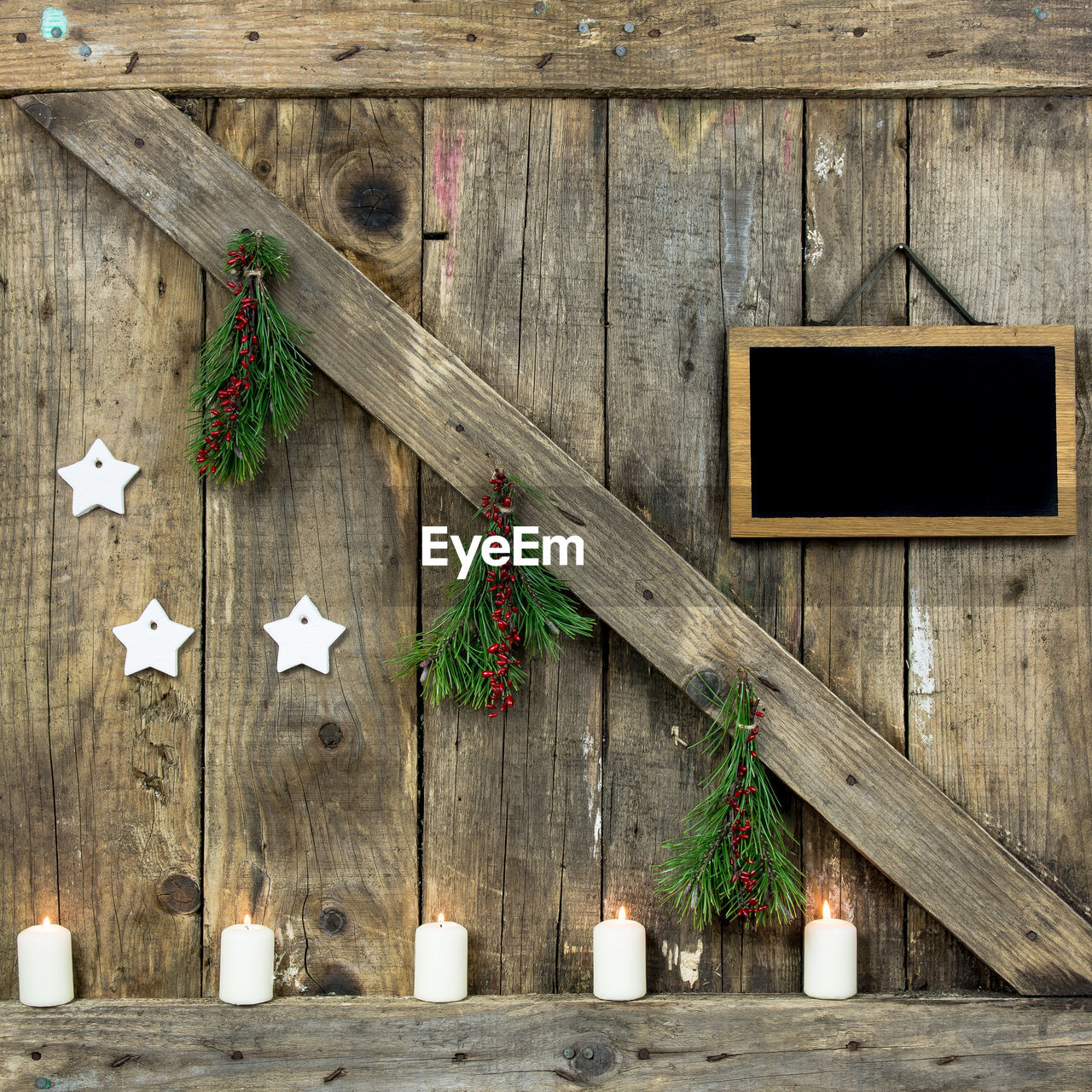 High angle view of christmas decorations on wooden wall