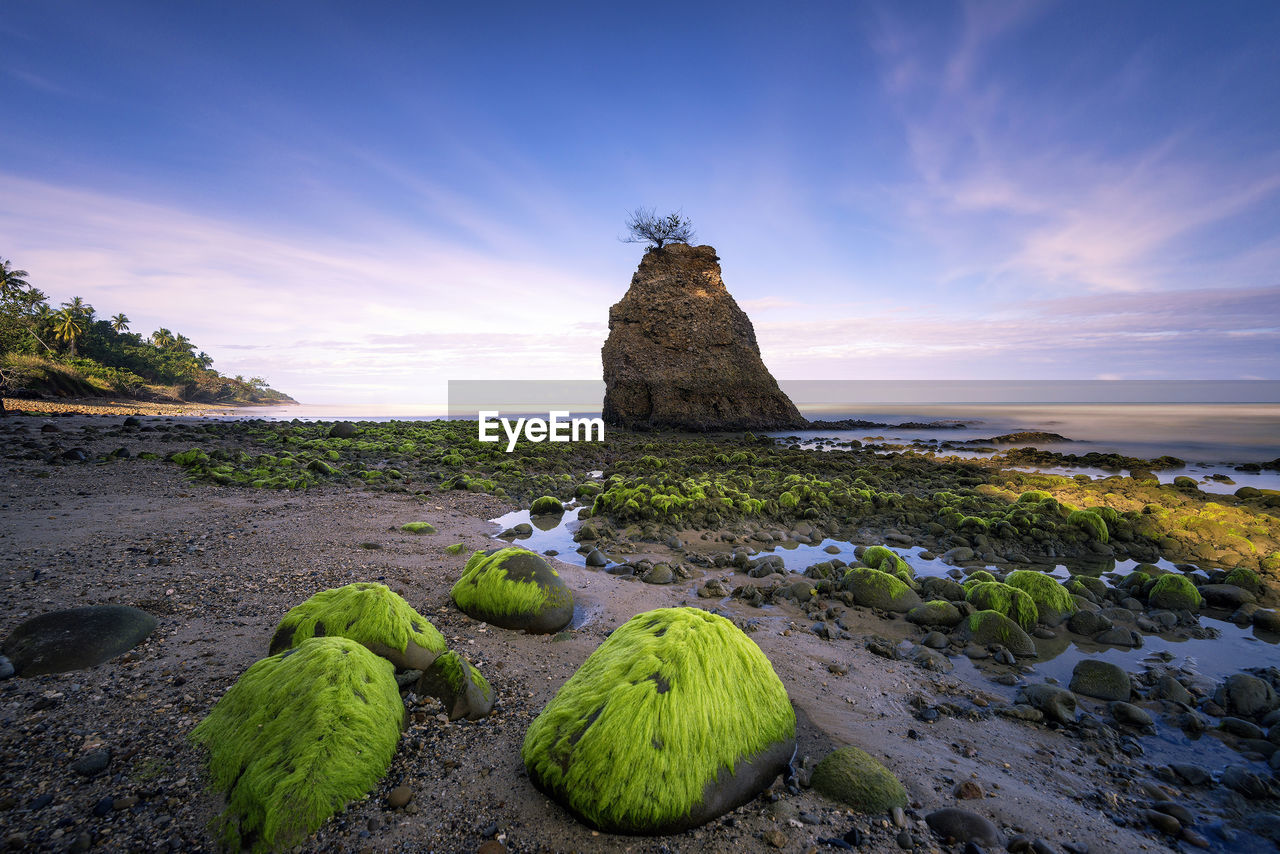 Scenic view of sea against sky at sunset