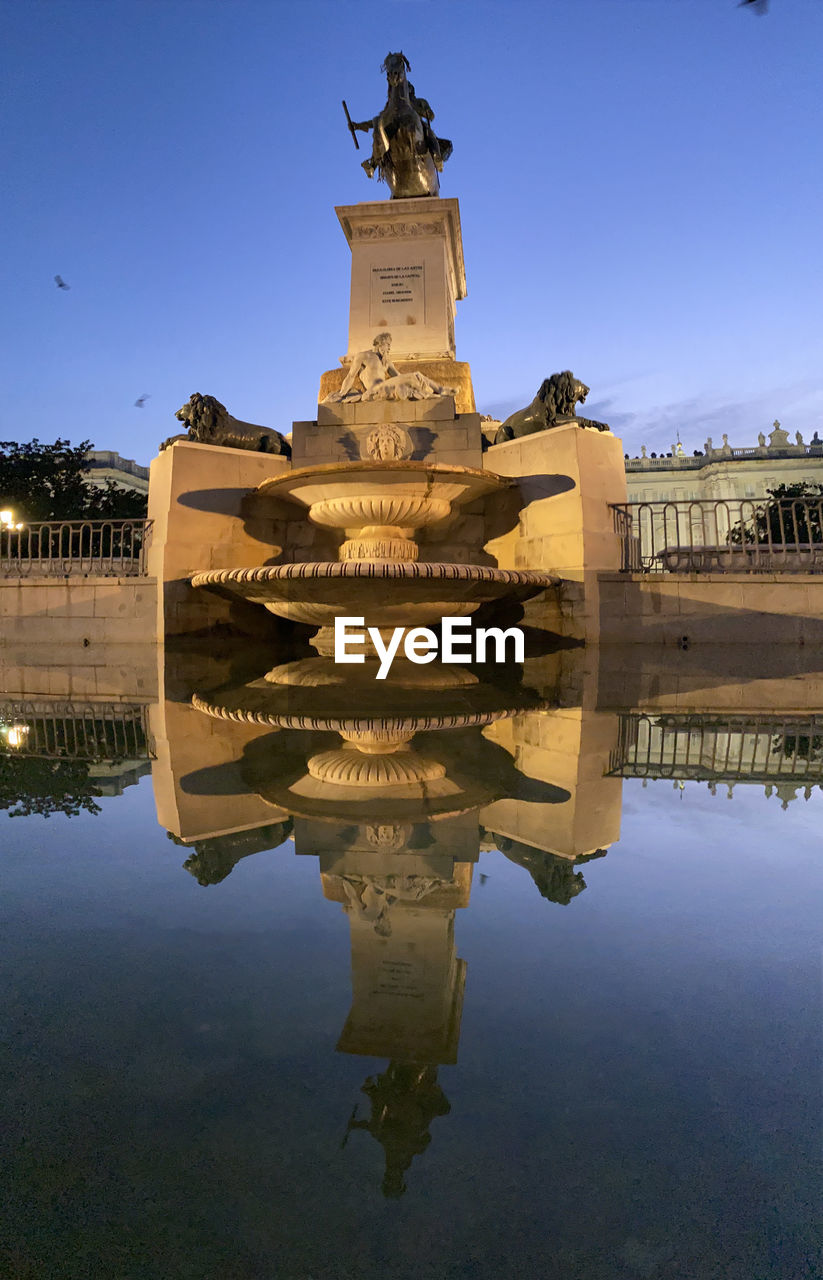 REFLECTION OF BUILDING IN WATER